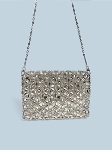 Detailed view of silver shimmering beaded square bag with intricate metallic mesh texture