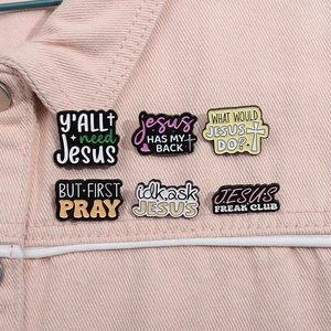 Set of six religious enamel pins with inspirational quotes on pink denim jacket collar