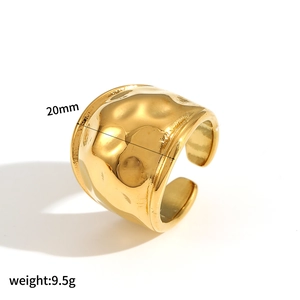 Macro detail of 20mm wide gold plated stainless steel ring with hammered texture