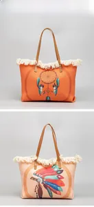 Detail of bohemian canvas tote bags featuring ethnic prints and white woven tassels