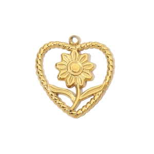 Detailed macro of gold-plated stainless steel heart pendant with hollow flower design