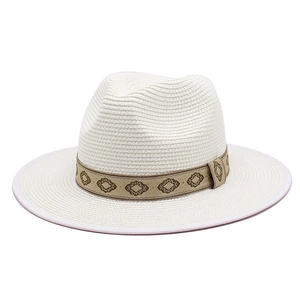 Classic white Panama straw hat with a geometric patterned brown band for sun protection