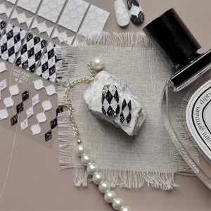 Japanese embossed nail stickers featuring black and white marble and diamond patterns