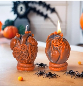 Detailed view of anatomical heart candles with mechanical gears and rose carvings