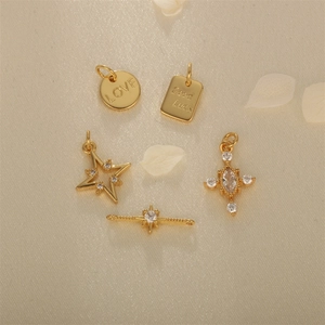 Gold-plated brass charm set with zircon stars and engraved LOVE Good Luck pendants