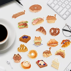 50 pieces of cute cartoon cat and bakery food graffiti stickers on a workspace desk
