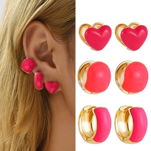 Y2K style pink enamel heart earring set with gold metal studs and huggie hoops