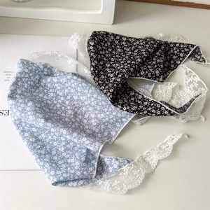 Close-up of floral hair scarves with lace trim in light blue and black color options
