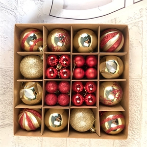 Top view of a 42-piece red and gold Christmas ball set with glitter and matte textures