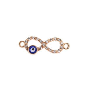 Macro detail of infinity evil eye charm connector in rose gold with pave crystals