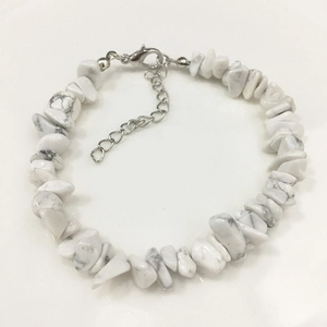 Macro detail of irregular white natural stone bracelet with adjustable silver clasp