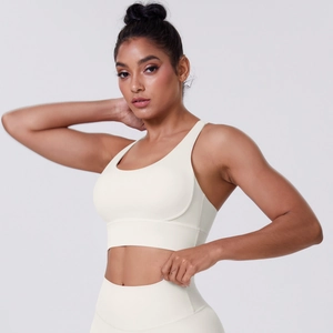 Close-up of off-white brushed sports bra and high-waist leggings with matte texture