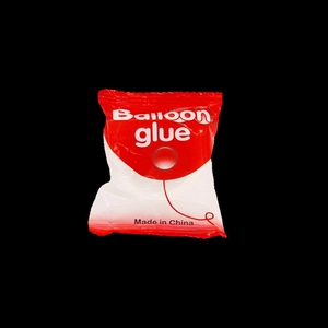 Individual pack of double-sided balloon glue dots for balloon styling and decoration