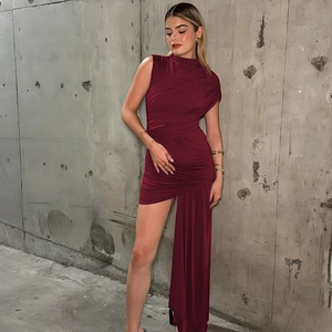 Detail of slim-fit dark red sleeveless dress featuring ruching and asymmetric drapery