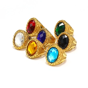 Set of seven vintage braided stainless steel rings with large colorful oval gemstones