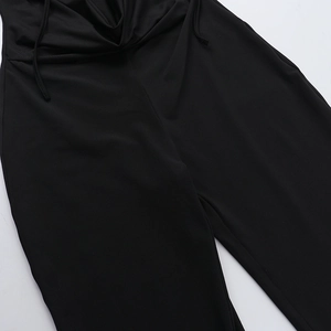 Detail of waist drawstring and gathered pleats on this black sexy open back jumpsuit