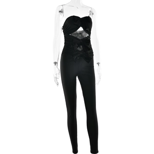 Detail of black strapless bodysuit with bow decorations and cutout accents on front
