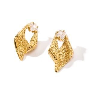Golden irregular twisted hoop earrings with textured finish and square zircon accent