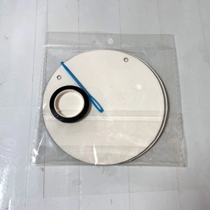DIY soccer party banner kit with white cardboard base, black ring and blue needle