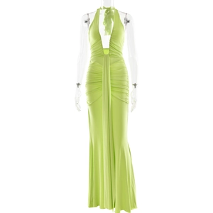 Detail of elegant bright green halter neck maxi dress with deep V-neck and pleats