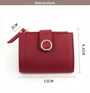 Deep red pebbled leather women's short wallet with gold buckle detailing and 12x9.5x2cm dimensions