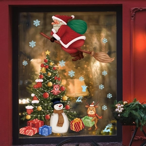 Weihnachtsfensteraufkleber mit Weihnachtsmann und Baum auf einer Glasscheibe