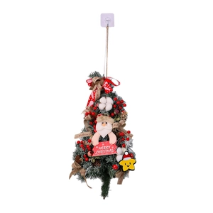 Hanging Santa Christmas tree decoration with red berries, pine cones, and a Merry Christmas sign