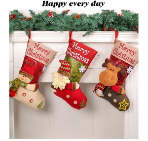 Detailed close-up of 3D Santa, Snowman, and Reindeer Christmas stockings on a white fireplace
