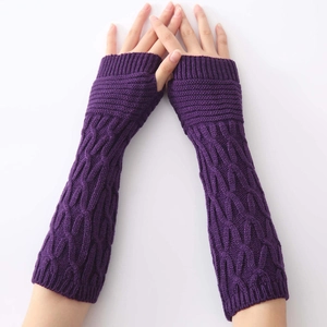 Long purple knit arm warmers with fingerless design and classic cable knit pattern