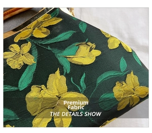 Detail of high-density jacquard fabric with yellow floral patterns and metal frame
