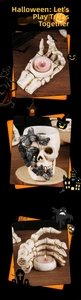 Macro detail of skeleton hand candle holder and skull ornament with silver butterflies