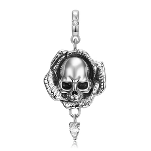 Macro detail of silver skull rose pendant with heart-shaped crystal for S925 bracelet