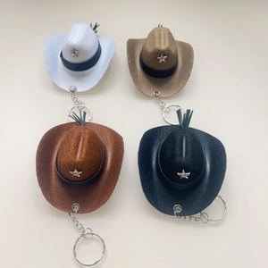 Detailed set of four 8cm felt cowboy hat keychains with star charms and tassels