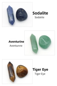 Detailed view of sodalite, aventurine and tiger eye hexagonal crystal points and stones