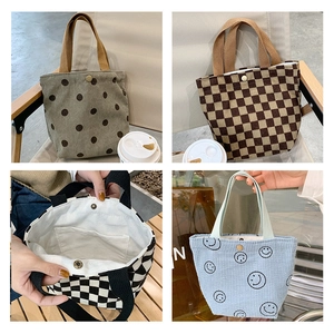 Detail of corduroy tote bags with polka dots and checks showing snap button and inner pocket