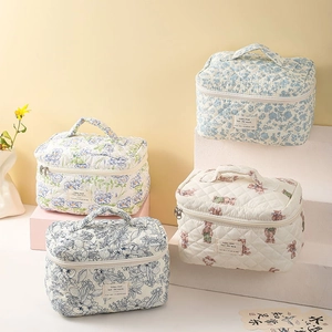 Floral quilted cotton makeup bags in various patterns with portable handle and zipper