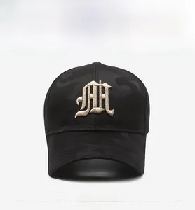 Detailed view of 3D gothic embroidery and camouflage fabric on this baseball cap