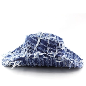 Deep blue distressed denim bucket hat with vintage frayed edges and white cotton fringe