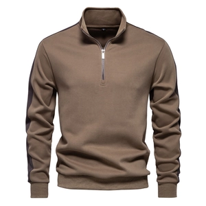 Detail of earth brown quarter-zip sweatshirt showing collar stitching and metal zipper