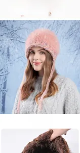 Detail view of winter plush knit hat with colorful sequins and ear protection straps