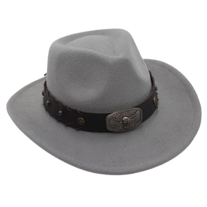 Close-up of a grey wool felt cowboy hat featuring a vintage bull head buckle and studs