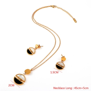 Detail of titanium steel jewelry set with black and white shell and 45cm chain
