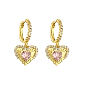 Macro shot of gold hoop earrings with pink heart zircon pendant and white stones