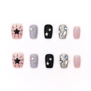 Handmade press-on nails featuring star designs, rhinestones and pink plaid patterns