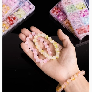 Detailed view of 8mm pink and yellow glass beads on elastic bracelets for DIY jewelry