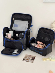 Detail view of double layer travel makeup bags with brush slots and mesh pockets