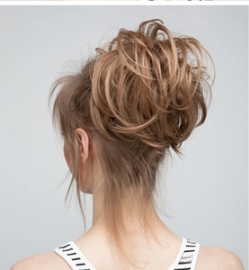 Messy bun hair piece for women in light golden brown showing natural volume and texture