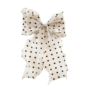 Elegant cream bow hair clip with black polka dots and flowing sheer chiffon ribbons