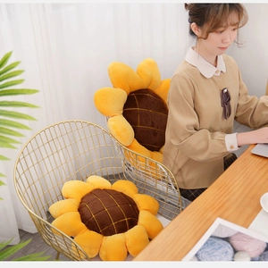 Cozy sunflower plush seat cushions with yellow petals on a stylish gold metal chair