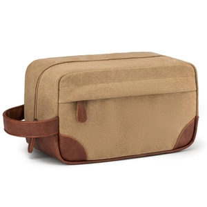 Detailed close-up of khaki waterproof canvas toiletry bag featuring brown PU leather handle